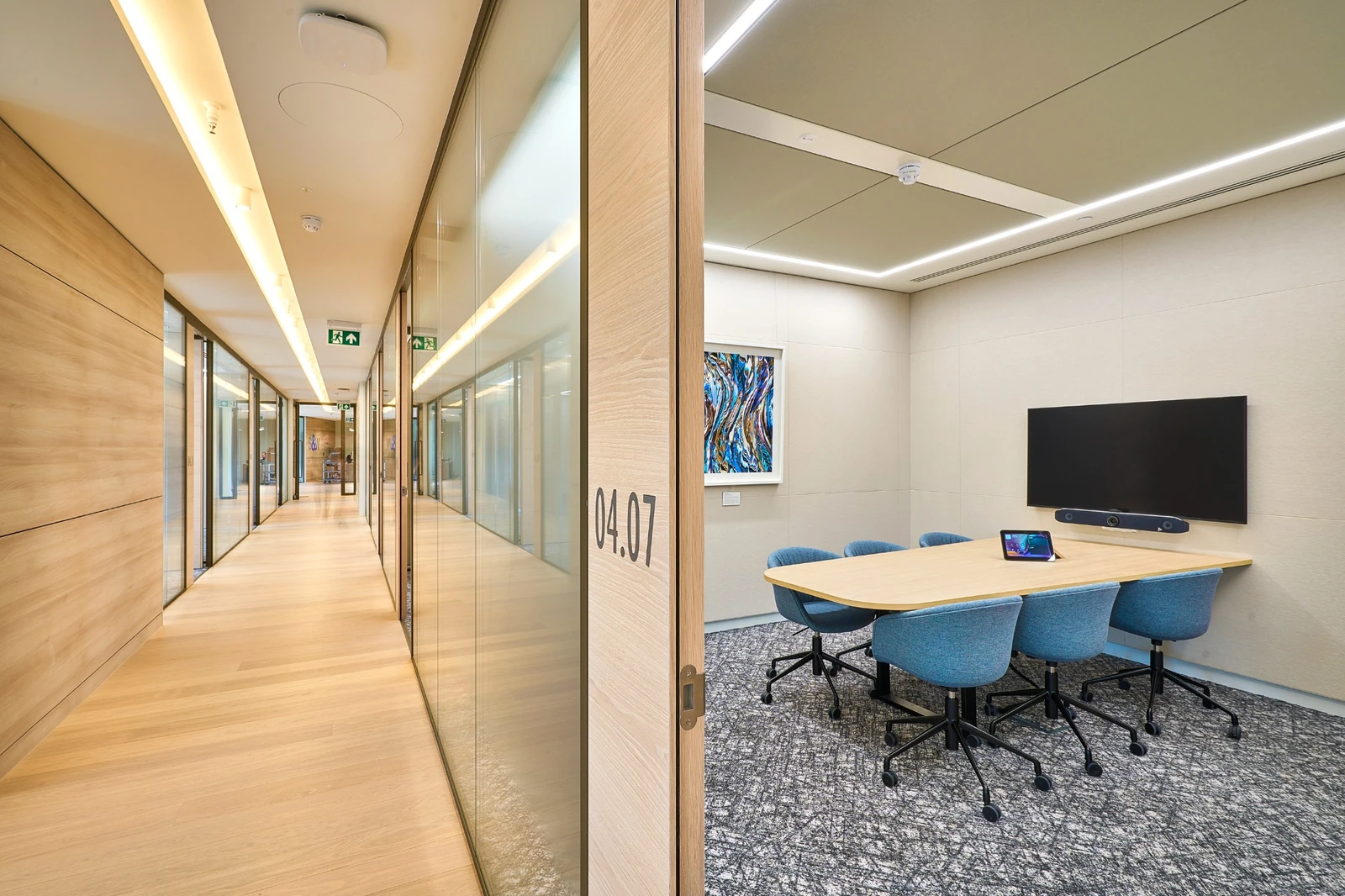 Timber-lined corridor and meeting-room frontage