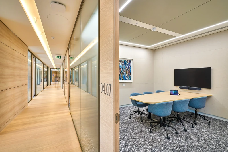 Timber-lined corridor and meeting-room frontage