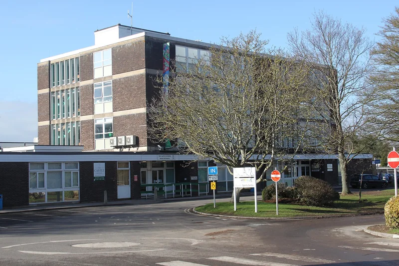 The Castle School, Taunton: four-storey brick main building with the single-storey main entrance in front